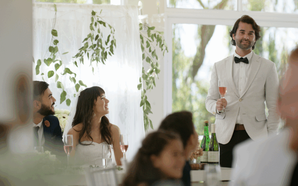 best man giving speech at traditional wedding top table